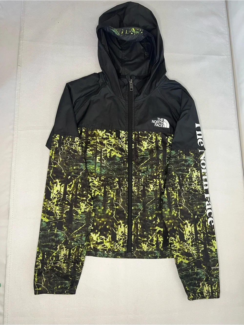 The North Face Kids Black Hooded Rain Jacket with Neon Green Print